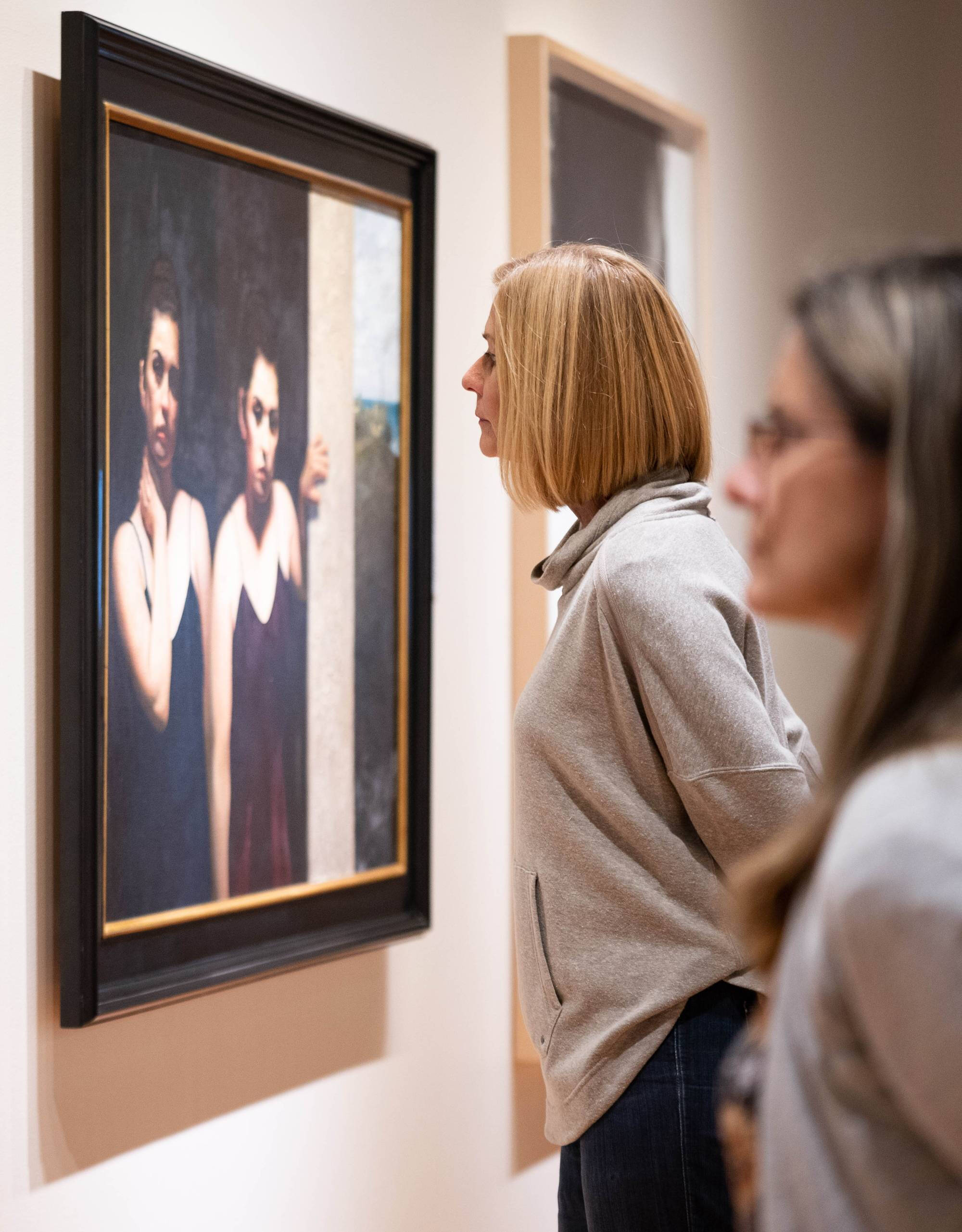 Visitors to the gallery looking at artwork